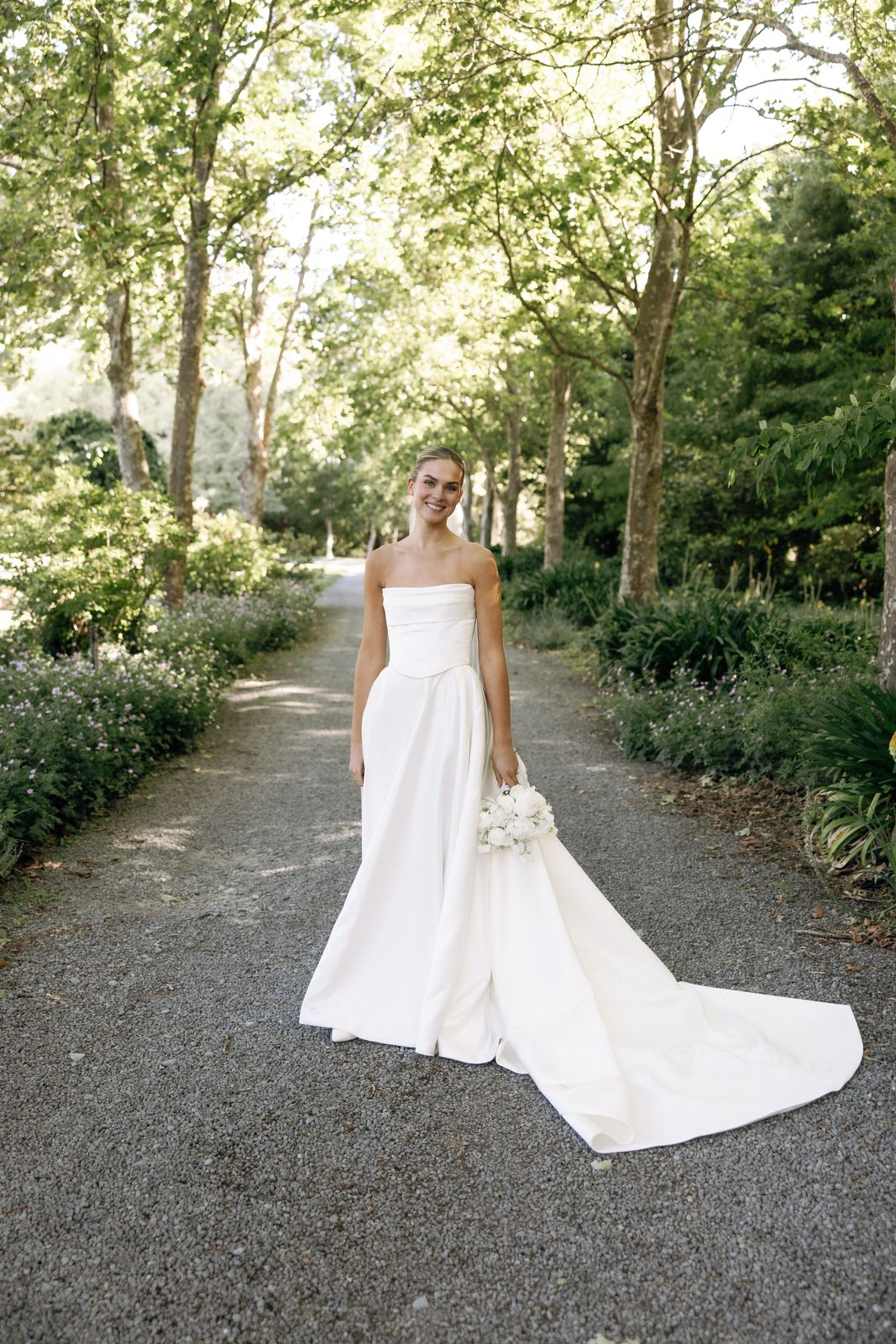 Samara wearing her bespoke wedding dress designed by Sarah Stoute, Christchurch — photo 13