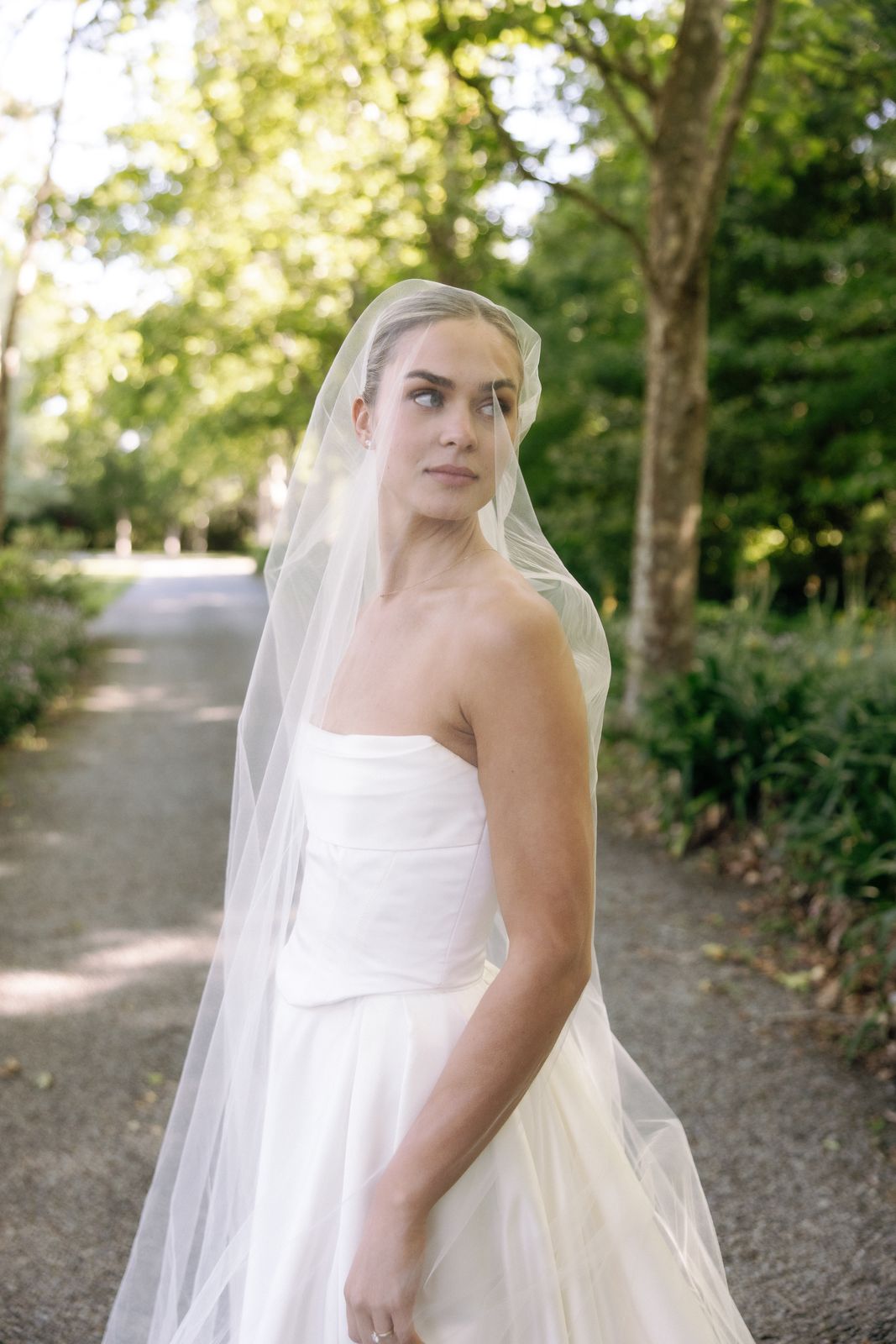 Samara wearing her bespoke wedding dress designed by Sarah Stoute, Christchurch — photo 18