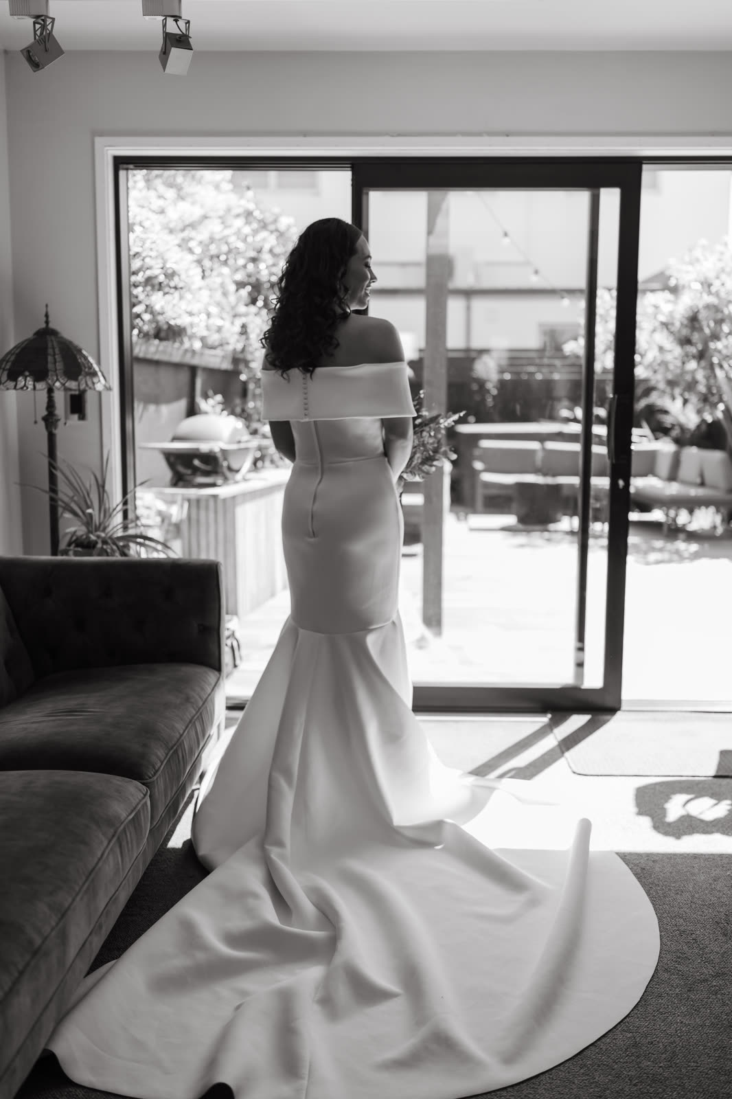Bride in a perfectly fitted wedding dress with a flowing train — alterations by Sarah Stoute Bespoke, Christchurch